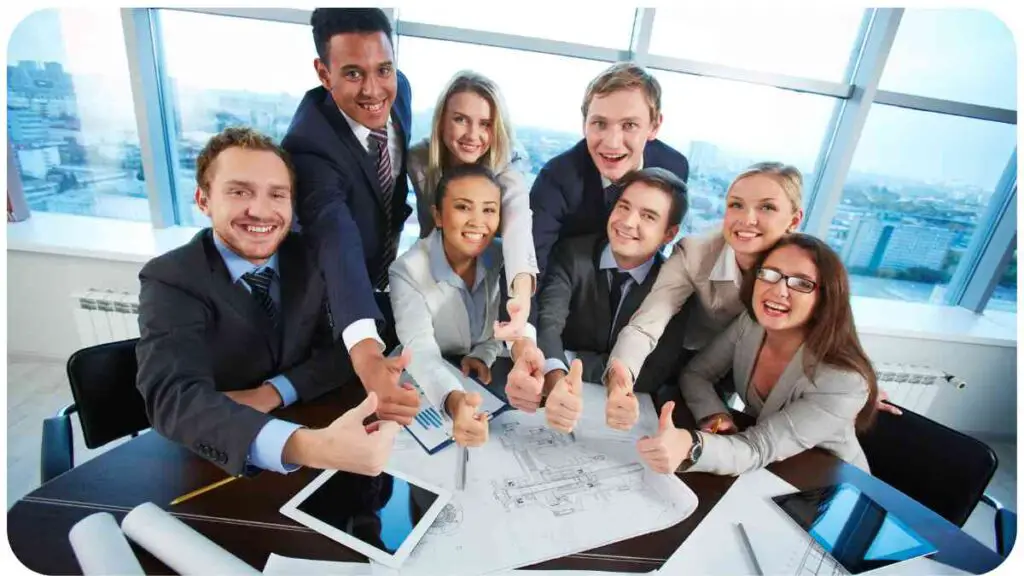a group of business people giving thumbs up